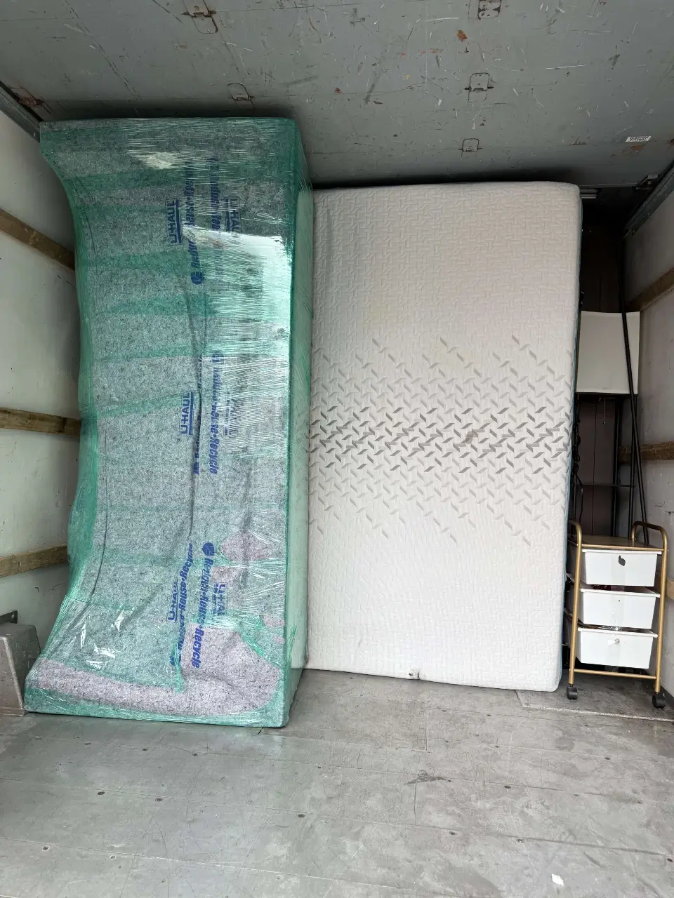 Image of packed mattresses ready to be moved to a new location