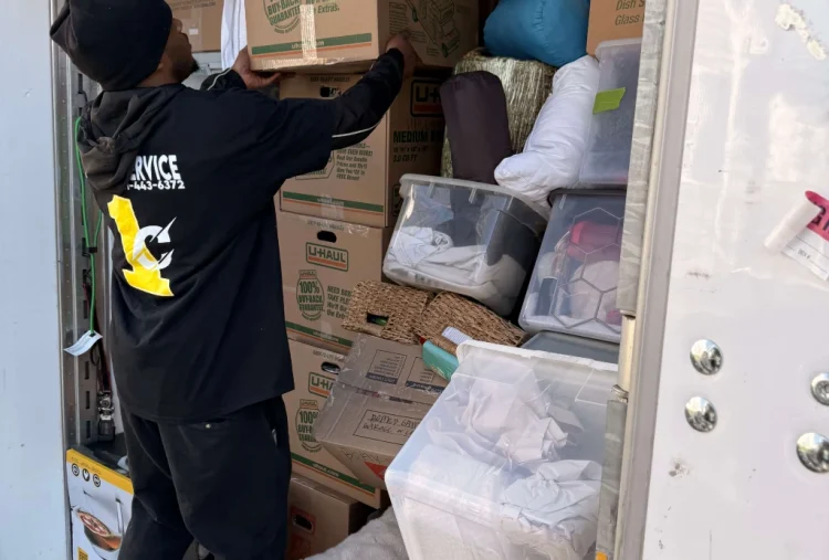 image of a mover packing goods for a long distance move