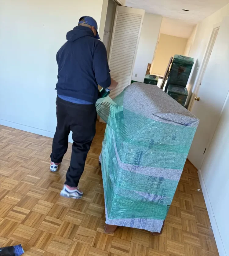 Movers packing goods