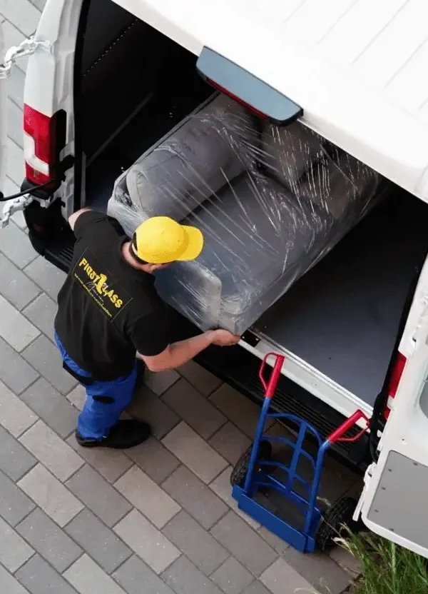 image of a mover from First class movers team of Providence, RI, putting packed goods into the truck.